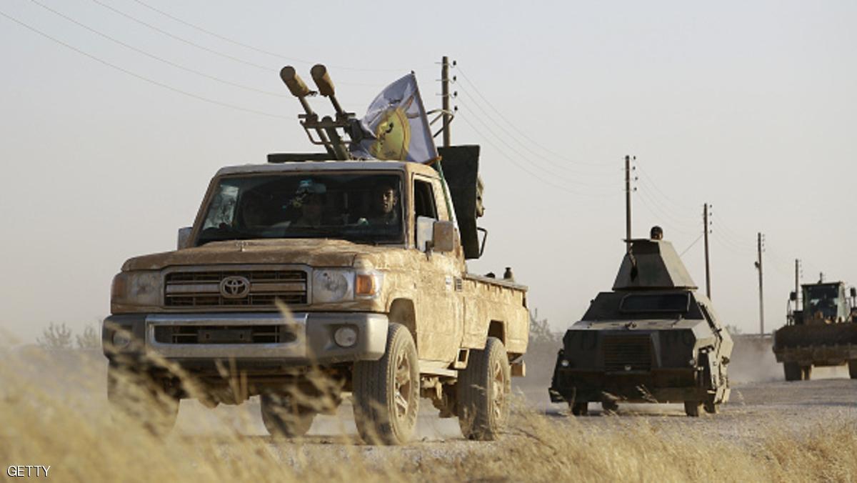 US-backed Kurdish and Arab fighters advance into the Islamic State (IS) jihadist's group bastion of Manbij, in northern Syria, on June 23, 2016. Backed by air strikes by the US-led coalition bombing IS in Syria and Iraq, fighters with the Syrian Democratic Forces (SDF) alliance entered Manbij from the south, a monitoring group said. / AFP / DELIL SOULEIMAN (Photo credit should read DELIL SOULEIMAN/AFP/Getty Images)
